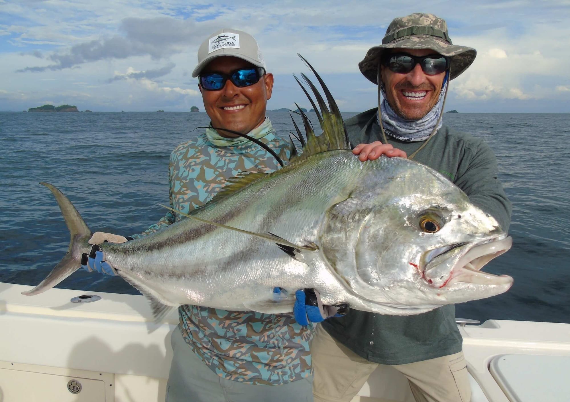 Angler holding a big roosterfish at Sport Fish Panama Island Lodge